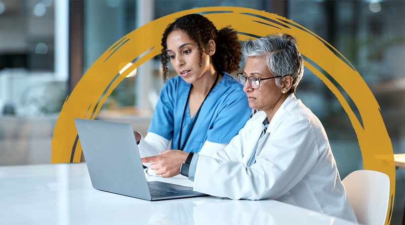 Older doctor and younger healthcare professional women on computer warm gold brushstroke